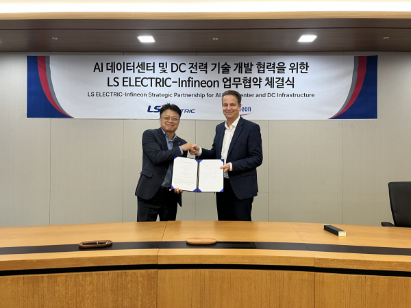 Ahn Gil-young, Executive Vice President and Head of Production/R&BD at LS ELECTRIC (left), poses for a commemorative photo with Andreas Weisl, Senior Vice President and Chief Sales Officer (CSO) of the Industrial & Infrastructure (I2) Business at Infineon Technologies/ Courtesy of LS ELECTRIC